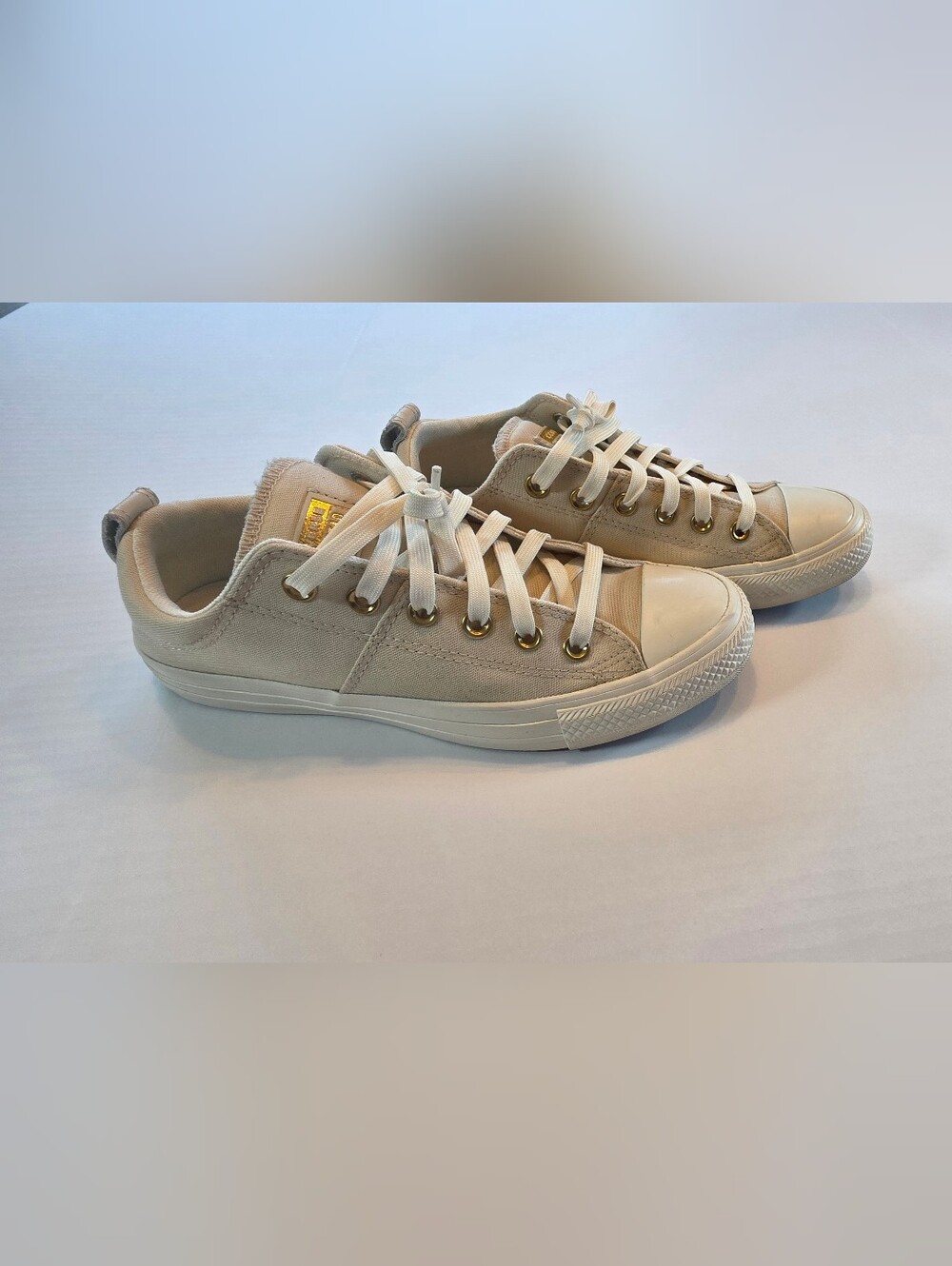 Converse Low-Top Sneakers in Cream with Gold Eyelets
